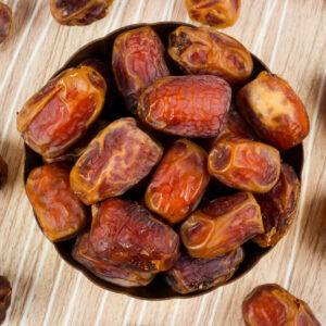 "A close-up of premium Rabia Dates, naturally dried and beautifully arranged on a wooden platter." "Naturally dried Rabia Dates in eco-friendly packaging, perfect for healthy snacking." "Delicious and nutrient-rich Rabia Dates displayed in a bowl, highlighting their natural sweetness." "A handful of chewy, golden-brown Rabia Dates, ideal for desserts, smoothies, and energy snacks." "Fresh and preservative-free Rabia Dates, showcased with their rich texture and natural color."