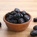 "Ajwa Dates from Madinah, showcasing their rich texture and natural sweetness, perfect for a healthy snack or energy boost."